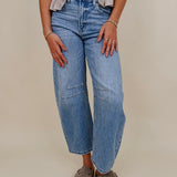 The Lovely Jean in light vintage wash denim with high rise barrel leg and raw hem — Paper Doll