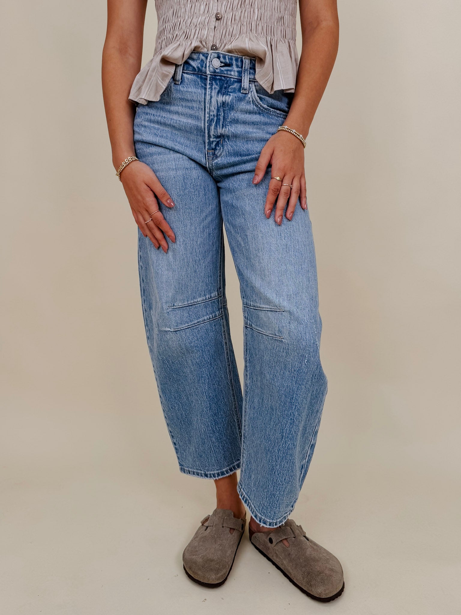 The Lovely Jean in light vintage wash denim with high rise barrel leg and raw hem — Paper Doll