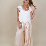 Hadleigh Smocked Neckline Blouse in white with tie neckline and flutter sleeves — Paper Doll