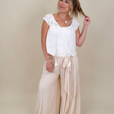 Hadleigh Smocked Neckline Blouse in white with tie neckline and flutter sleeves — Paper Doll