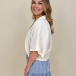 Kira Smocked Shorts in light denim blue with smocked waist and tiered ruffle hem — Paper Doll