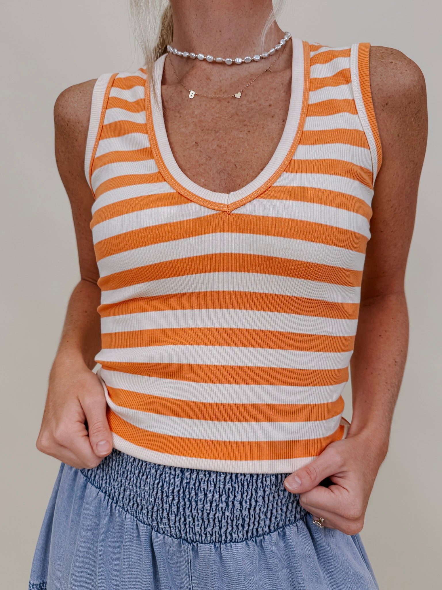 Penny Striped Tank in orange and cream stripes with a V-neck — Paper Doll
