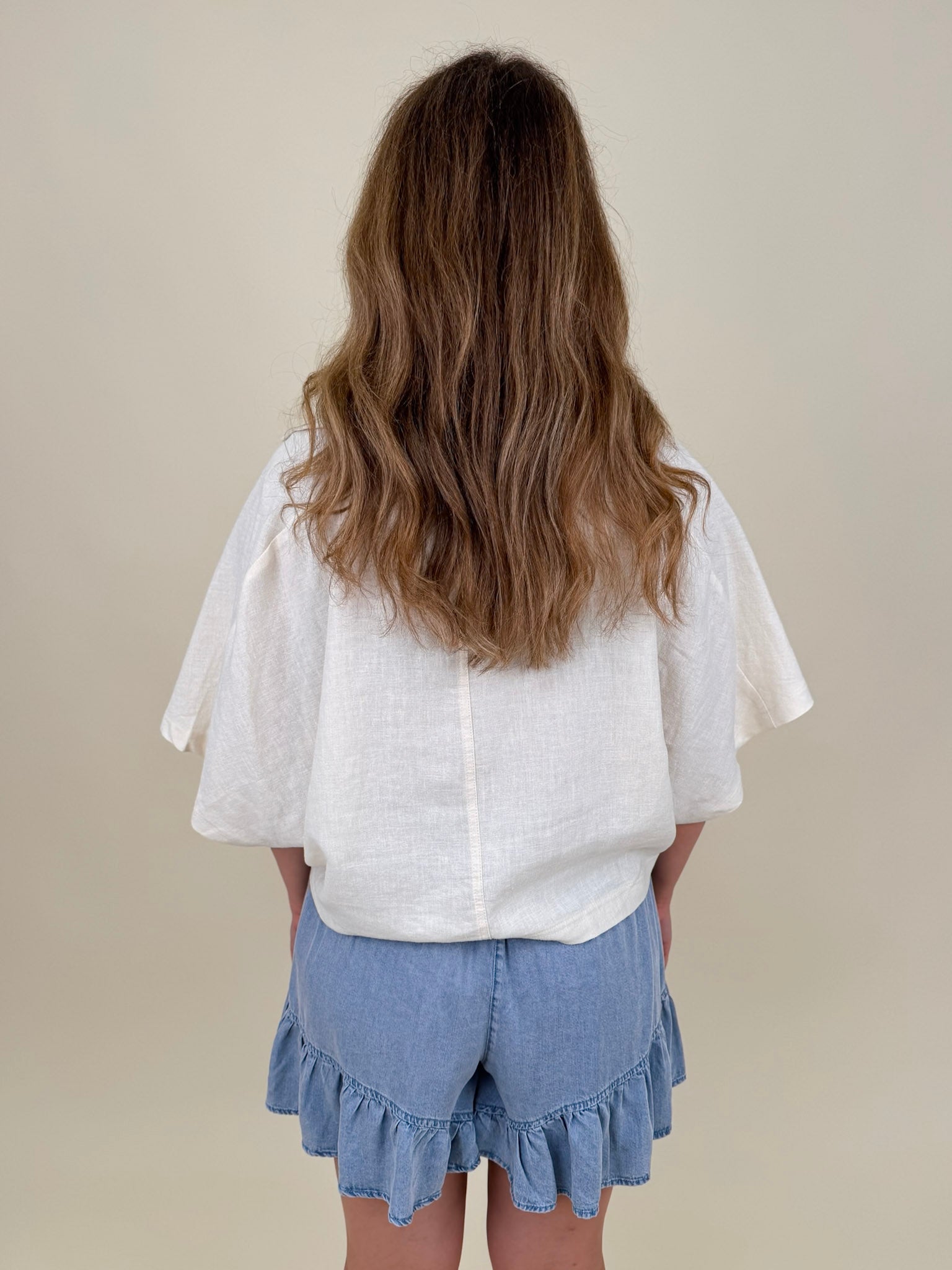 Galilea Oversized Open Collar Top in cream with relaxed collar and boxy fit — Paper Doll