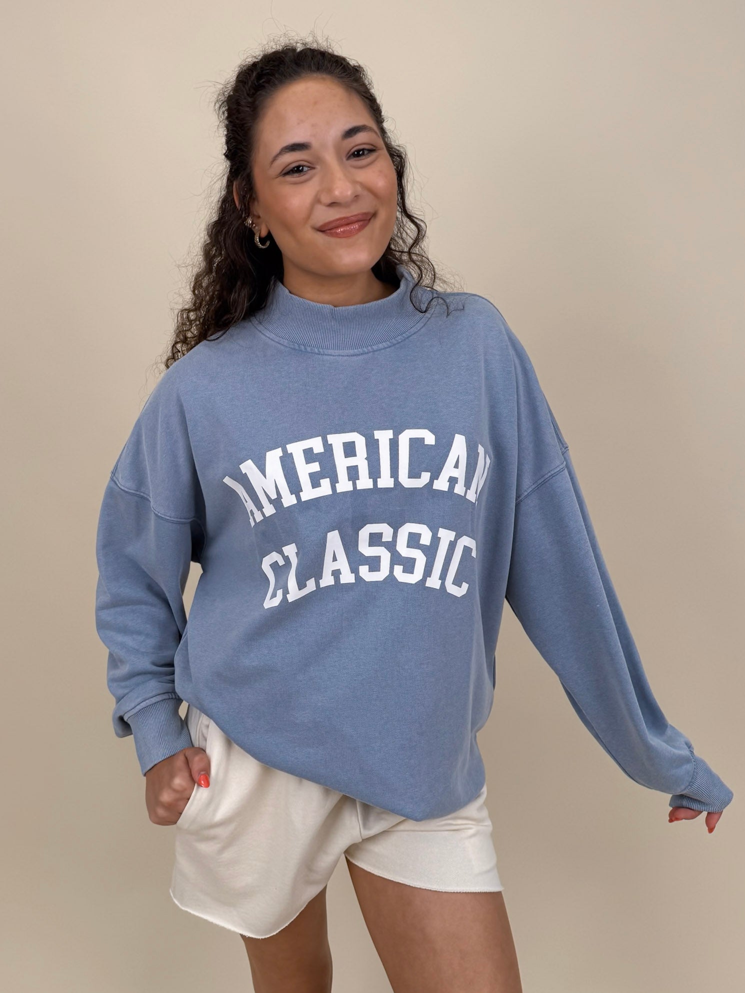 "American Classic" Reversible Sweater in light blue with varsity graphic and mock neck — Paper Doll

