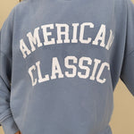 "American Classic" Reversible Sweater in light blue with varsity graphic and mock neck — Paper Doll
