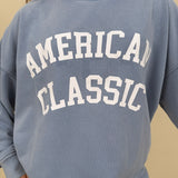"American Classic" Reversible Sweater in light blue with varsity graphic and mock neck — Paper Doll
