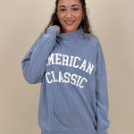 "American Classic" Reversible Sweater in light blue with varsity graphic and mock neck — Paper Doll
