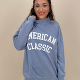 "American Classic" Reversible Sweater in light blue with varsity graphic and mock neck — Paper Doll
