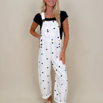 Brooke Polka Dot Overalls in cream denim with navy polka dot print and brass hardware — Paper Doll