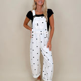 Brooke Polka Dot Overalls in cream denim with navy polka dot print and brass hardware — Paper Doll