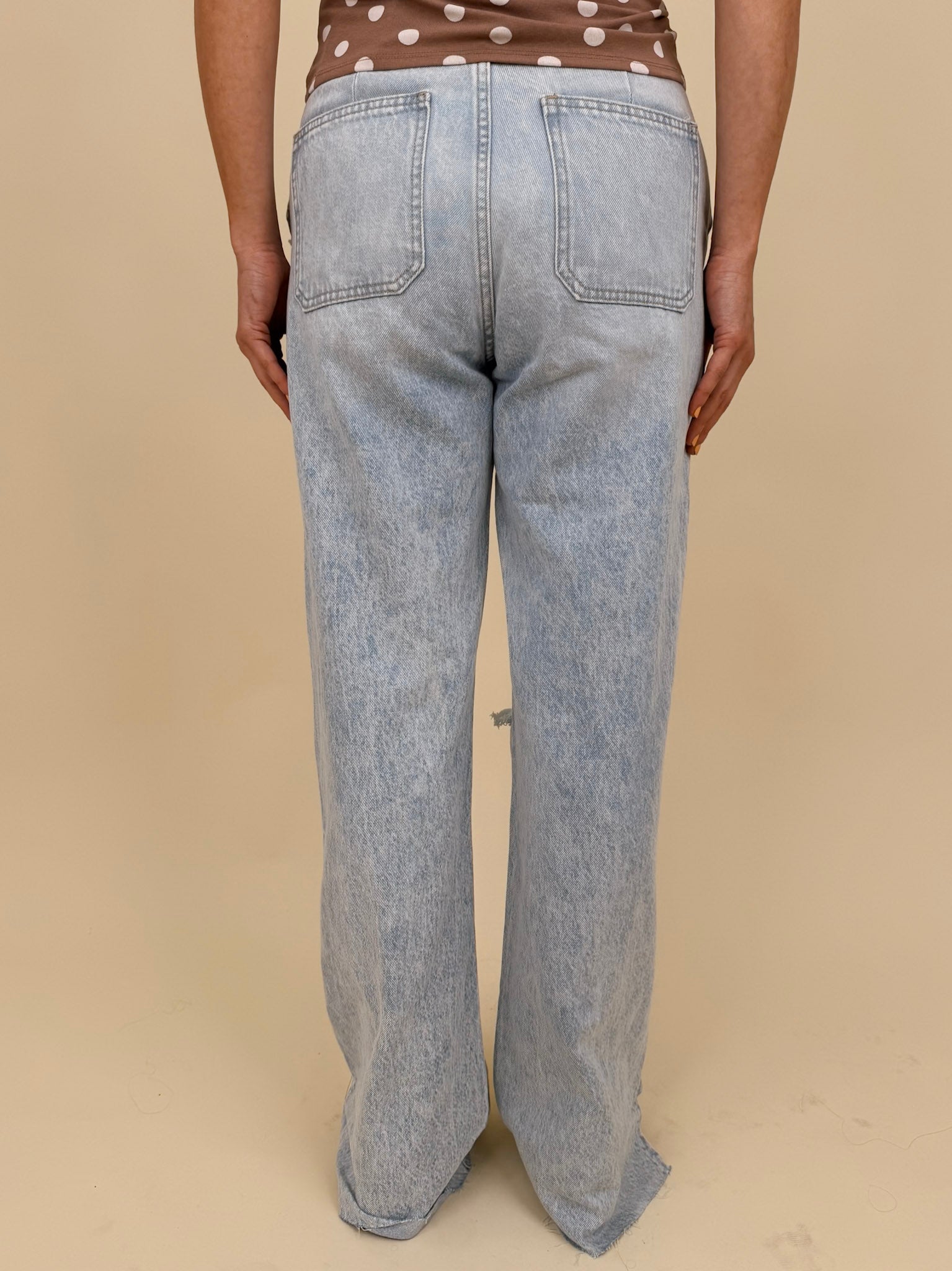 Christina Jeans in light acid wash with wide leg silhouette and distressed knee cutouts — Paper Doll
