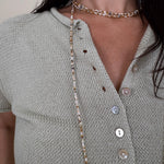 Stay Cool Sweater Top with pearl button front closure and short sleeve knit silhouette — Paper Doll