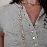 Stay Cool Sweater Top with pearl button front closure and short sleeve knit silhouette — Paper Doll