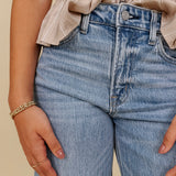 The Lovely Jean in light vintage wash denim with high rise barrel leg and raw hem — Paper Doll