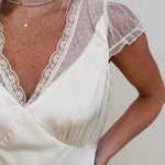 Isadora Satin Midi Dress in light yellow with lace trim and mesh flutter sleeves — Paper Doll