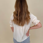 Dani Ruffle Blouse with cream ruffle neckline and pintuck detailing — Paper Doll