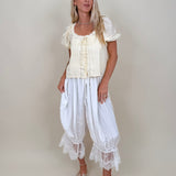 Charlotte Drapery Lace Trim Pants in ivory with gathered balloon leg and floral lace scallop hem — Paper Doll