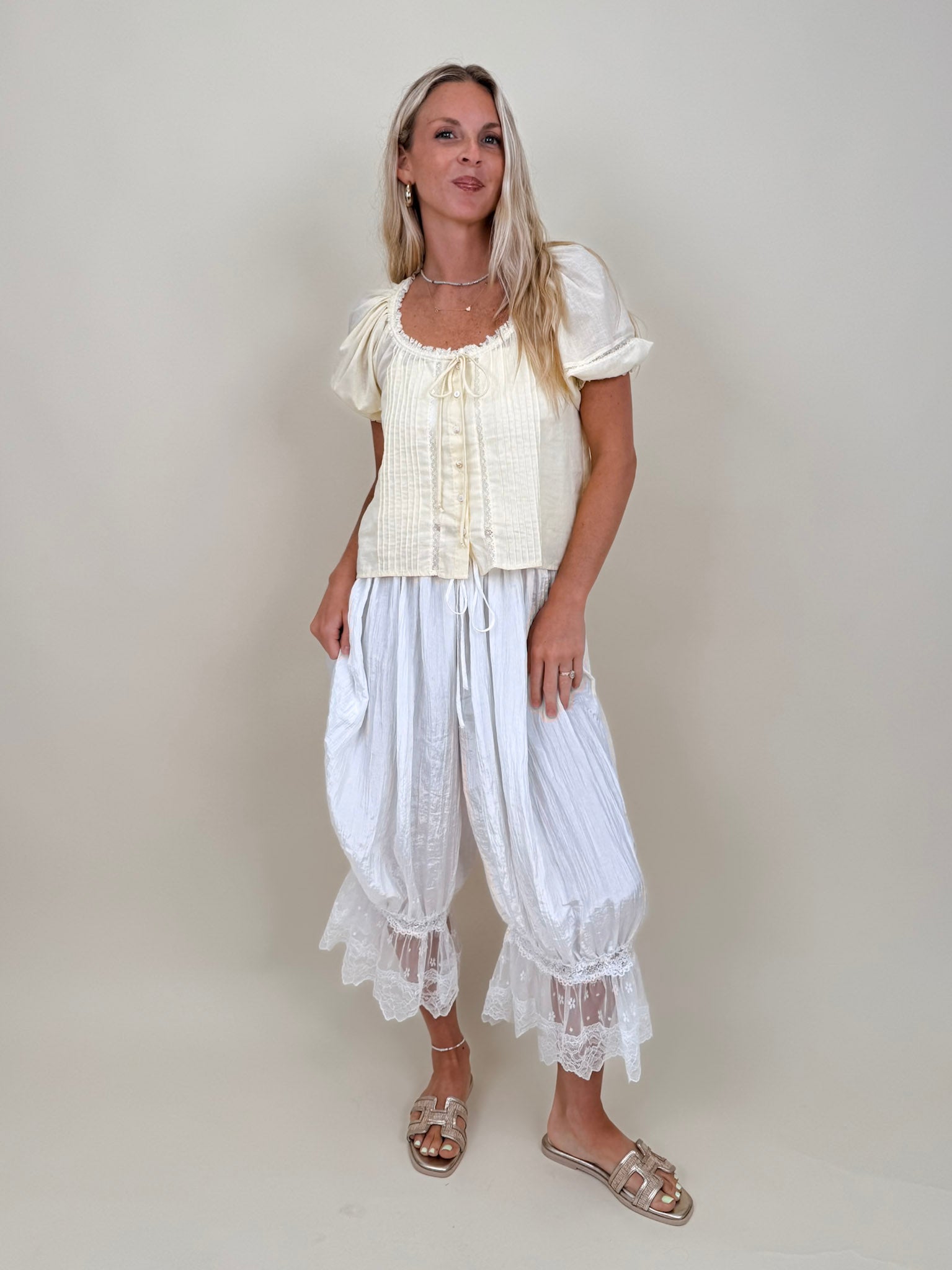Charlotte Drapery Lace Trim Pants in ivory with gathered balloon leg and floral lace scallop hem — Paper Doll