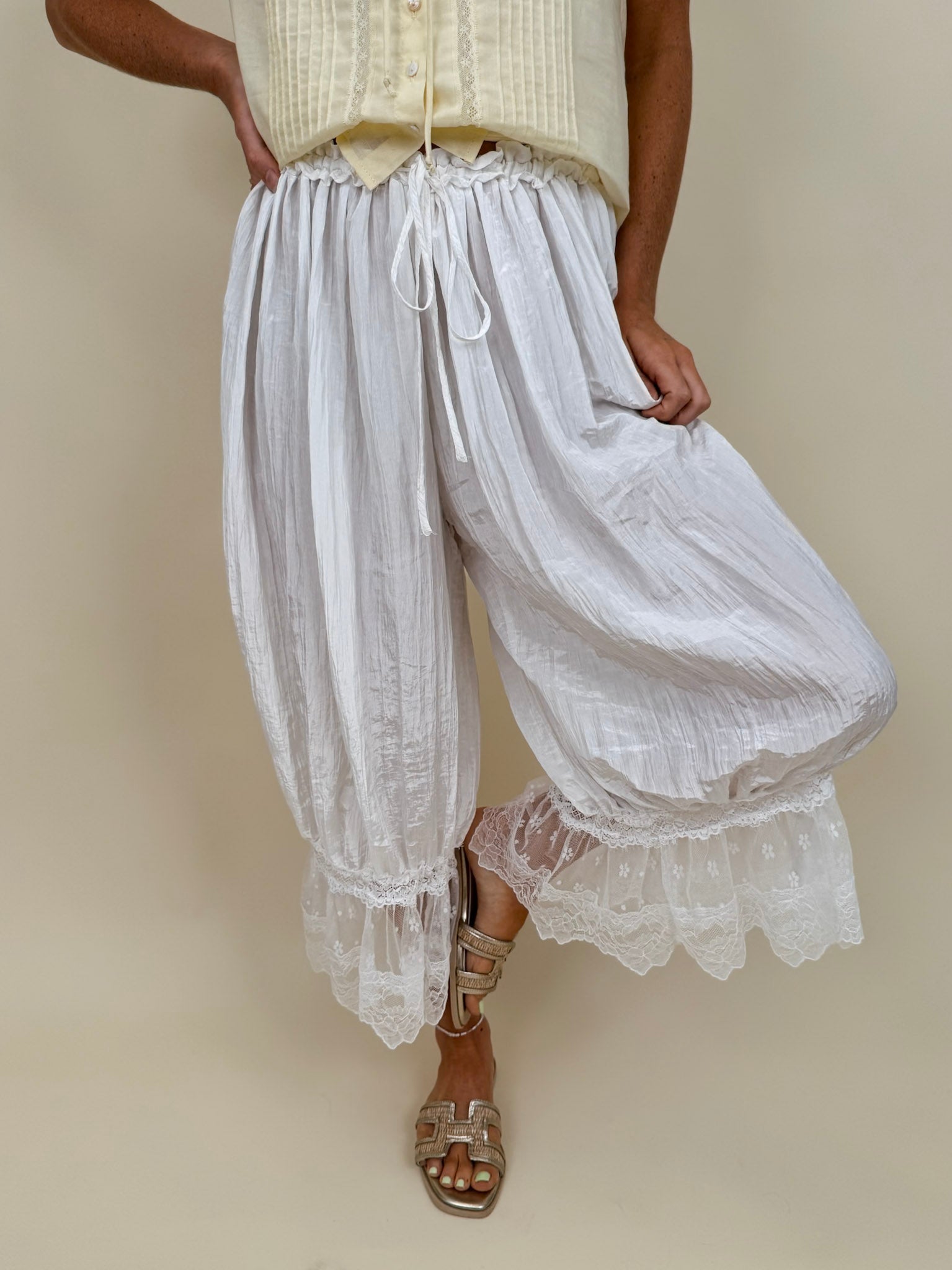Charlotte Drapery Lace Trim Pants in ivory with gathered balloon leg and floral lace scallop hem — Paper Doll