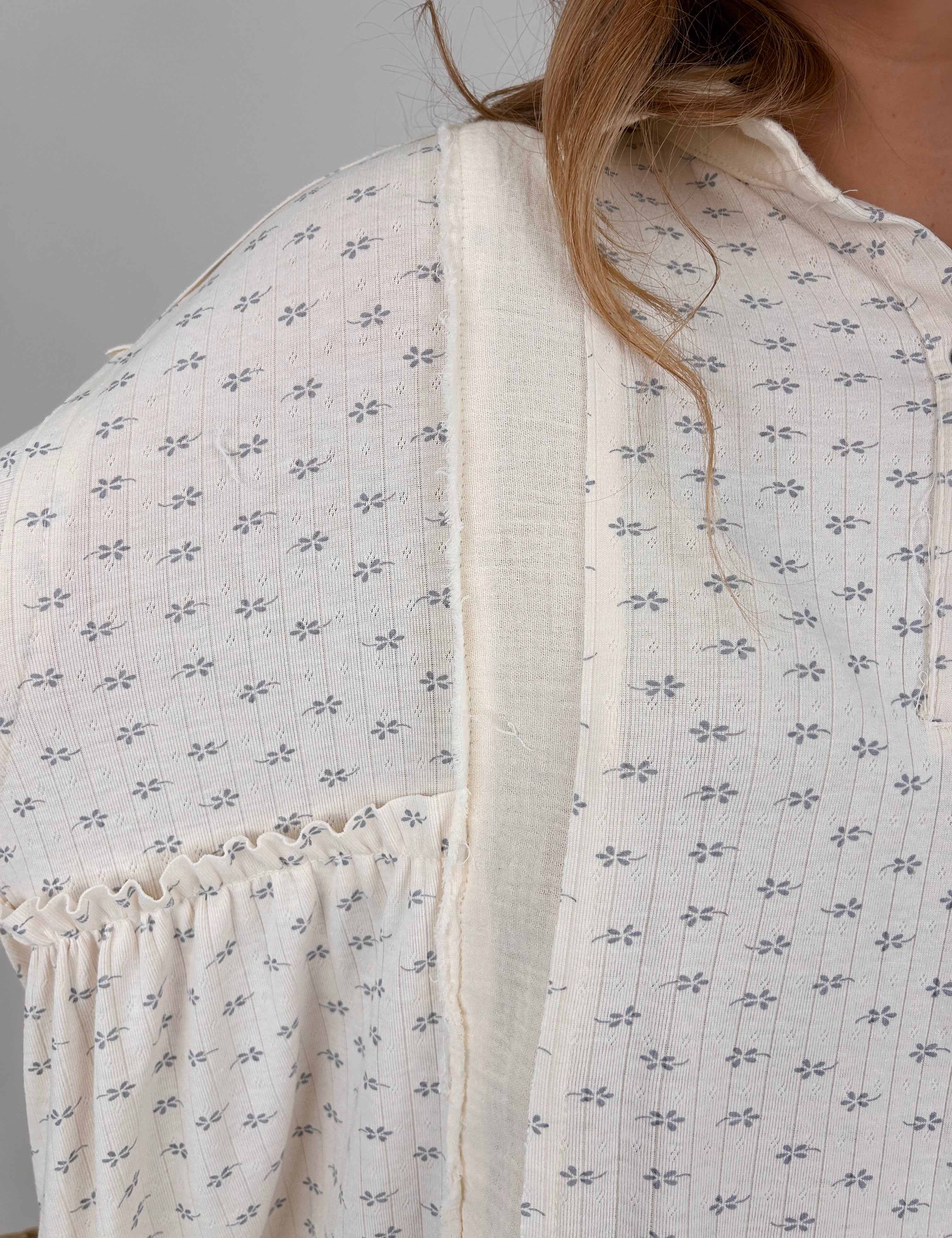 Baby Blossom Knit Blouse with small floral print, button front detail, and long sleeves in relaxed fit