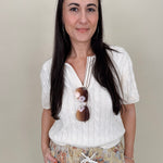 Take Heart Cable Knit Polo Shirt in cream with polo collar and contrast stripe placket — Paper Doll
