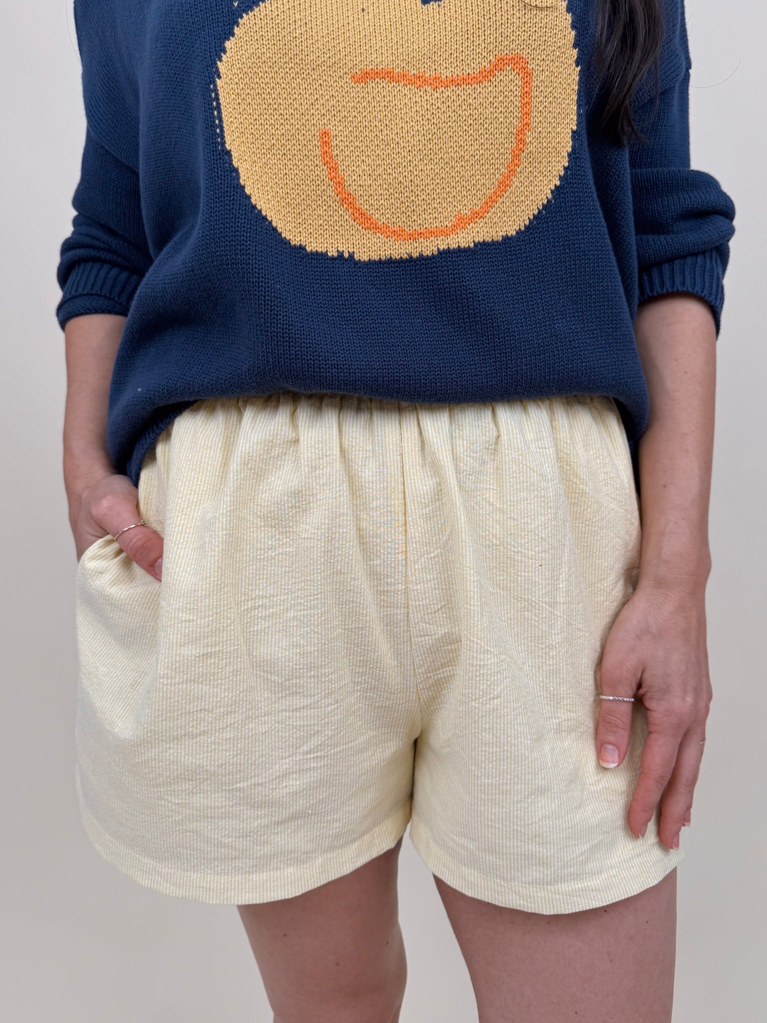 The Sunshine Shorts in lemon and white stripe seersucker with elastic waist and side pockets — Paper Doll