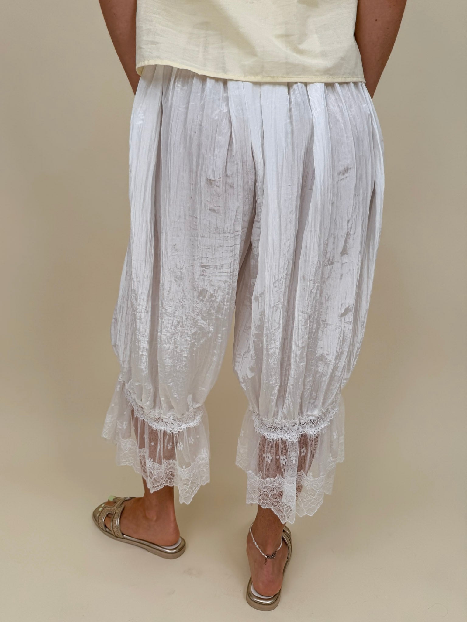 Charlotte Drapery Lace Trim Pants in ivory with gathered balloon leg and floral lace scallop hem — Paper Doll