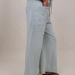 Braxton Cozy Pant in washed sage with a drawstring waist and wide leg — Paper Doll
