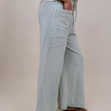 Braxton Cozy Pant in washed sage with a drawstring waist and wide leg — Paper Doll
