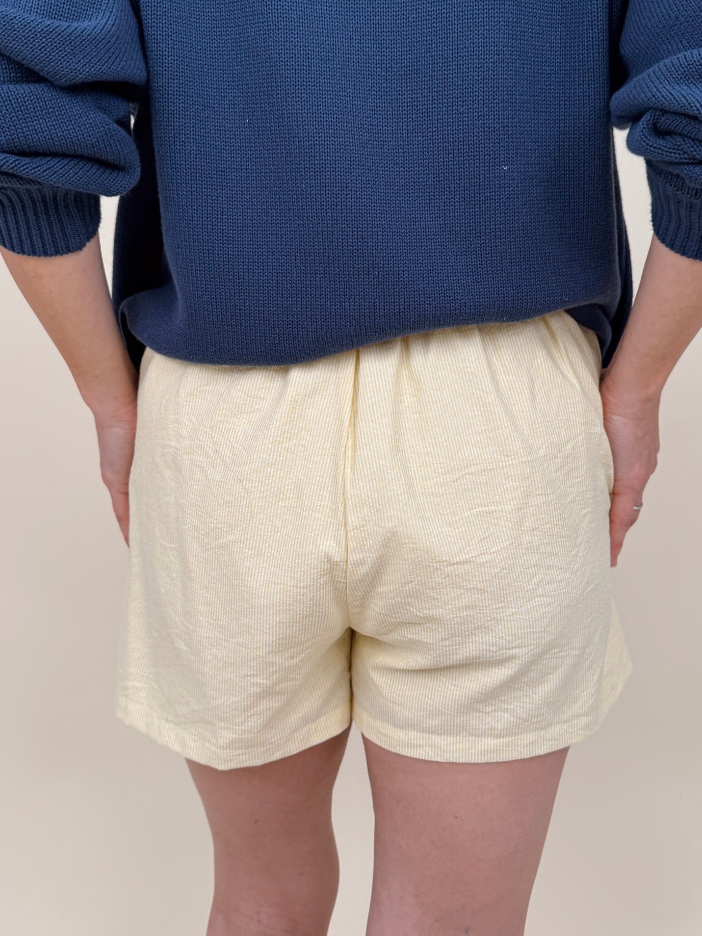 The Sunshine Shorts in lemon and white stripe seersucker with elastic waist and side pockets — Paper Doll
