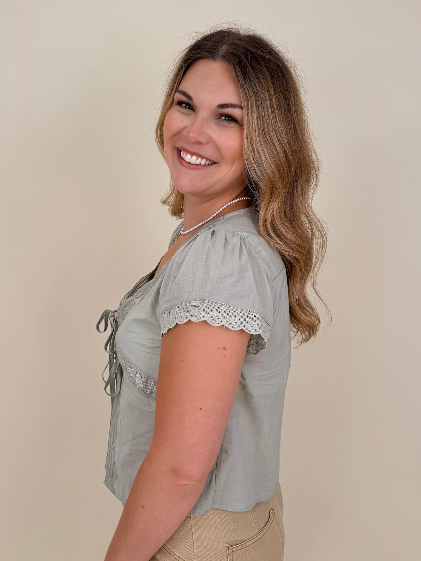 At the Start Front Tie Top in sage with tonal embroidery and scalloped lace trim — Paper Doll