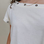Just A Dream Metal Circle Trim Top in cream with metal grommet neckline trim — Paper Doll
