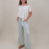Just A Dream Metal Circle Trim Top in cream with metal grommet neckline trim — Paper Doll
