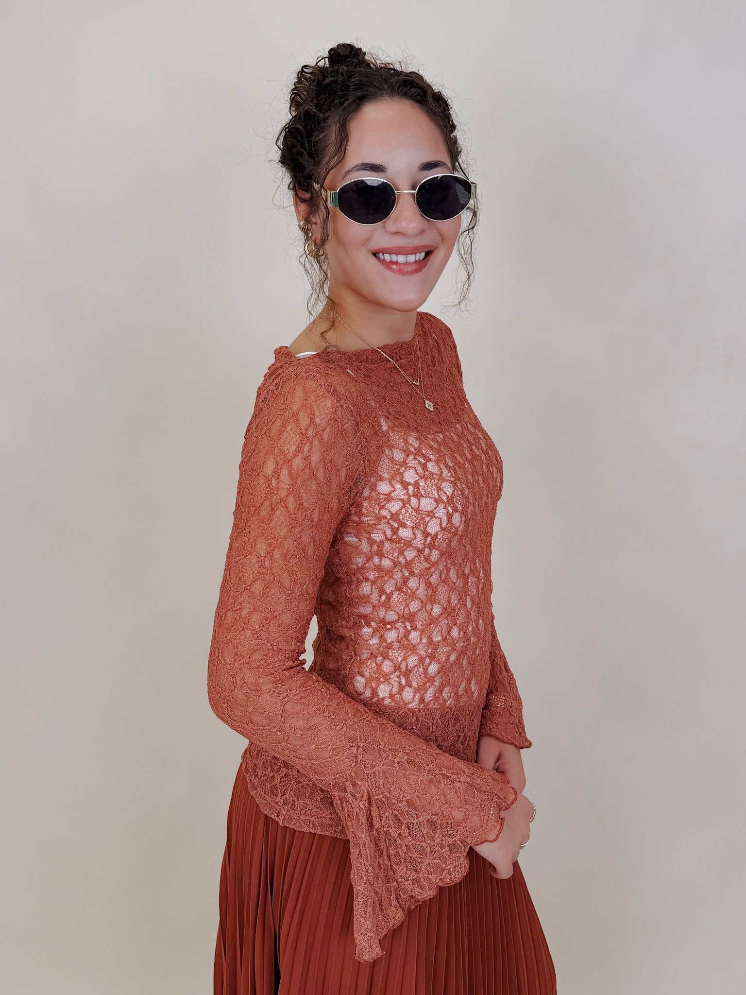 Sierra Casual Top in terracotta open lace knit with bell sleeves — Paper Doll