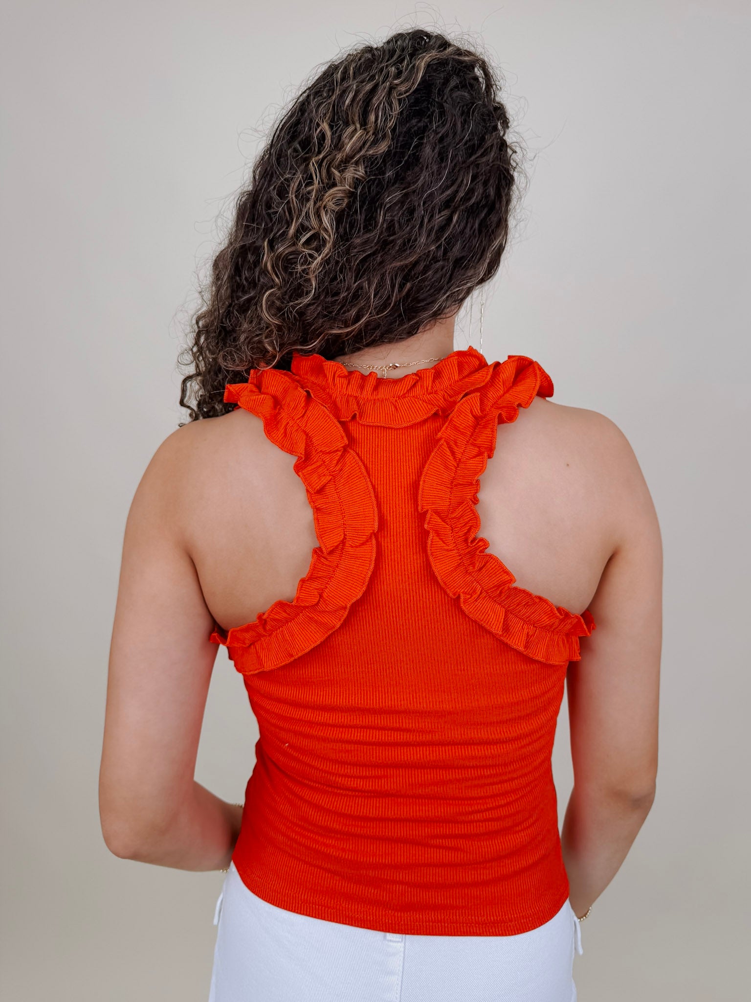 Tammy Ruffle Tank in red with a ruffle shoulder and neckline — Paper Doll