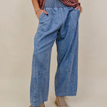Annie Denim Casual Pants in light wash denim with smocked waist and barrel leg — Paper Doll