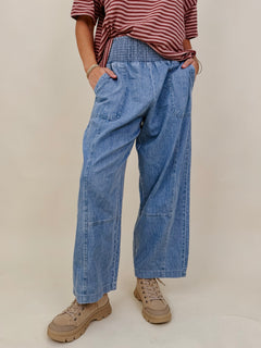 Annie Denim Casual Pants in light wash denim with smocked waist and barrel leg — Paper Doll