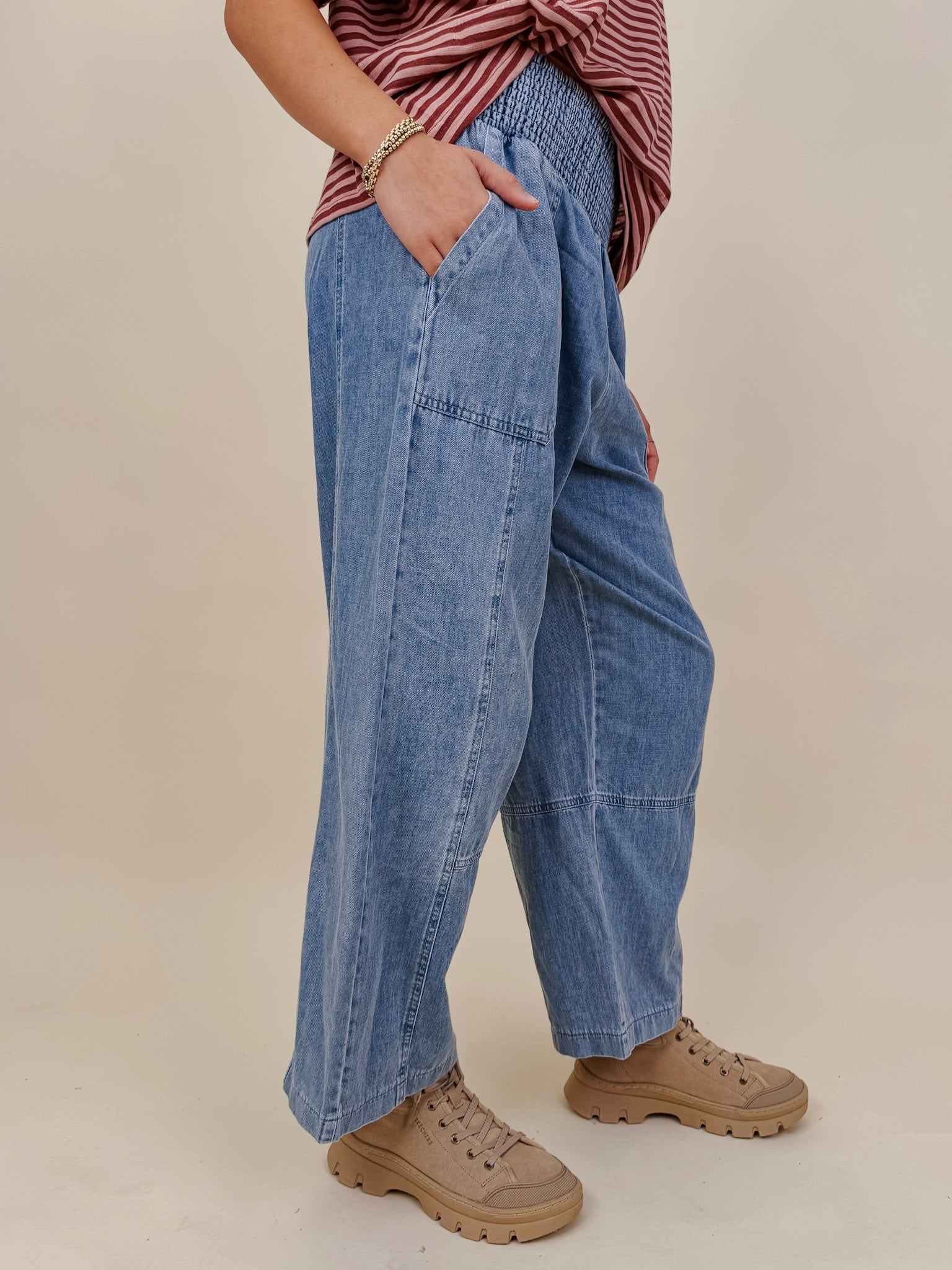 Annie Denim Casual Pants in light wash denim with smocked waist and barrel leg — Paper Doll