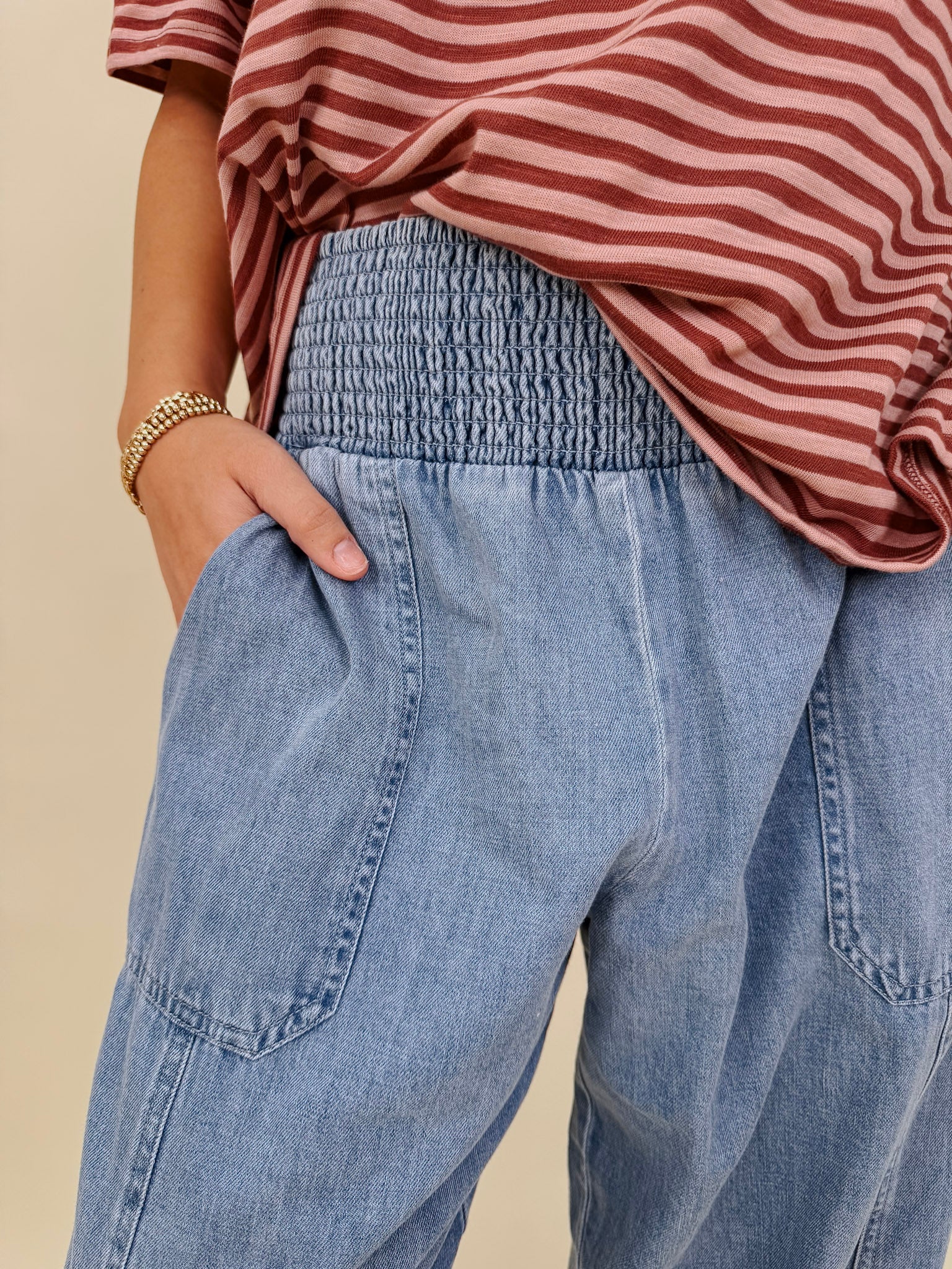 Annie Denim Casual Pants in light wash denim with smocked waist and barrel leg — Paper Doll