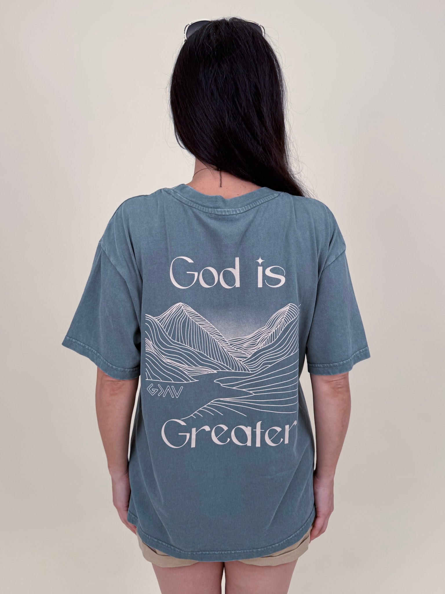 God Is Greater Unisex Tee in washed slate with mountain graphic on back — Paper Doll