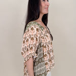 Kace Floral Boho Blouse in cream botanical print with embroidered yoke and smocked ruffle sleeves — Paper Doll
