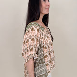 Kace Floral Boho Blouse in cream botanical print with embroidered yoke and smocked ruffle sleeves — Paper Doll
