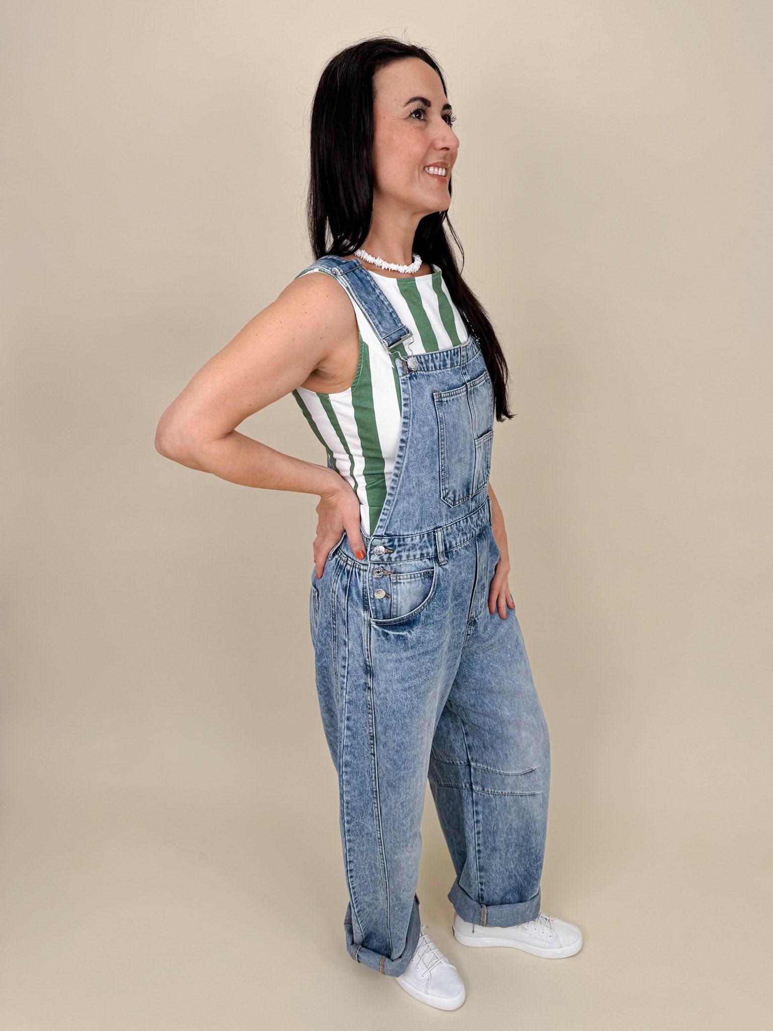 Tracy Barrel Overalls in light acid wash denim with barrel leg and cross-back straps — Paper Doll
