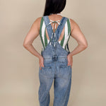 Tracy Barrel Overalls in light acid wash denim with barrel leg and cross-back straps — Paper Doll
