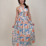 Off To Kokomo Maxi Dress in beige multi stamp print with halter neckline and open back bow — Paper Doll
