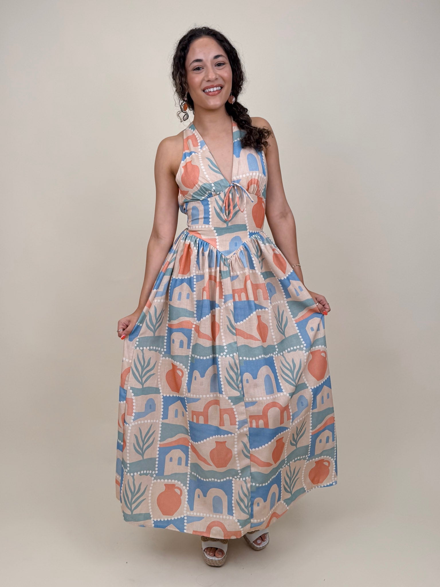 Off To Kokomo Maxi Dress in beige multi stamp print with halter neckline and open back bow — Paper Doll
