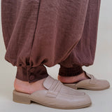 Penny For Your Thoughts Pant in cocoa brown twill with pleated front and smocked ankle cuff — Paper Doll