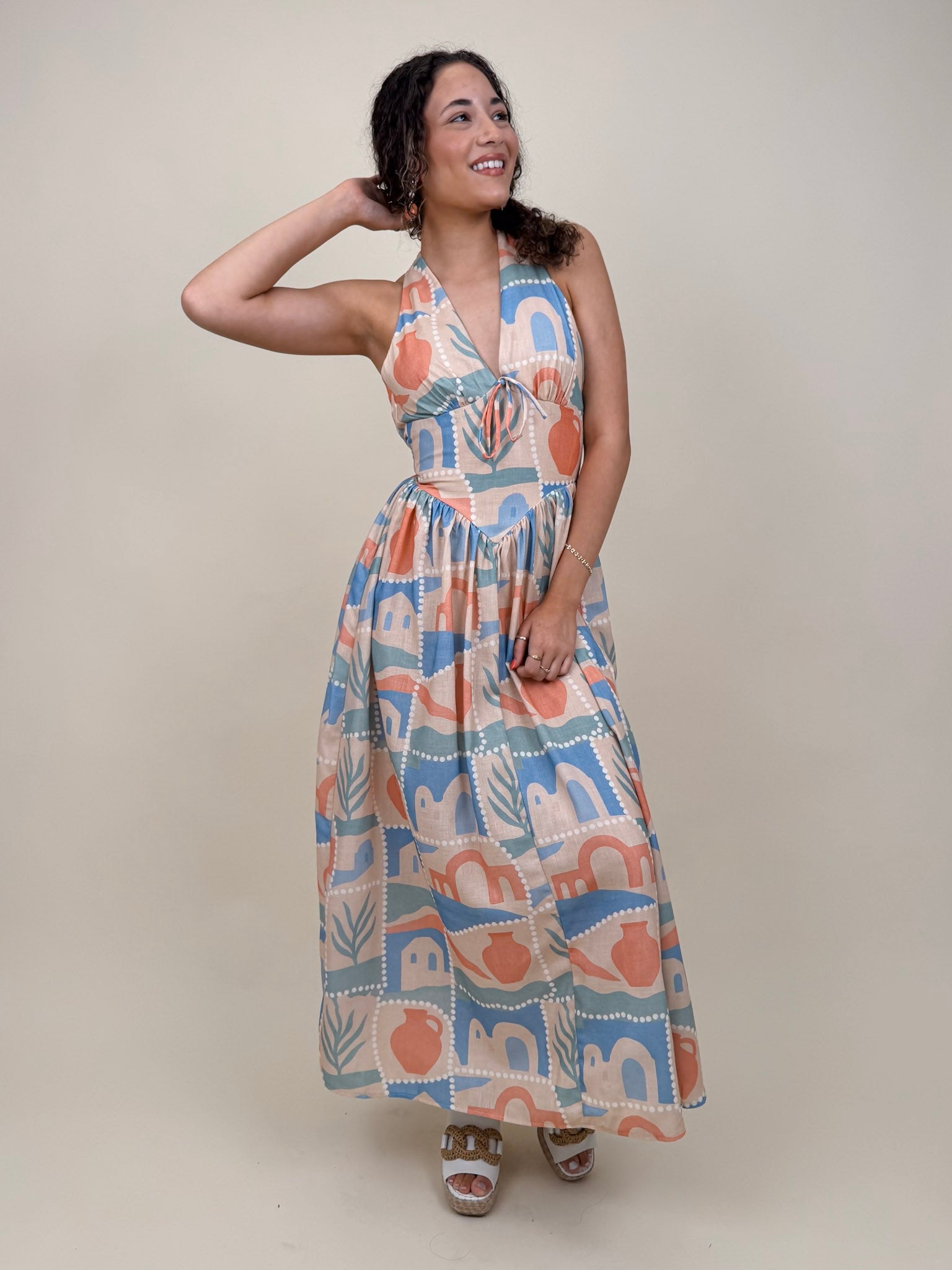 Off To Kokomo Maxi Dress in beige multi stamp print with halter neckline and open back bow — Paper Doll
