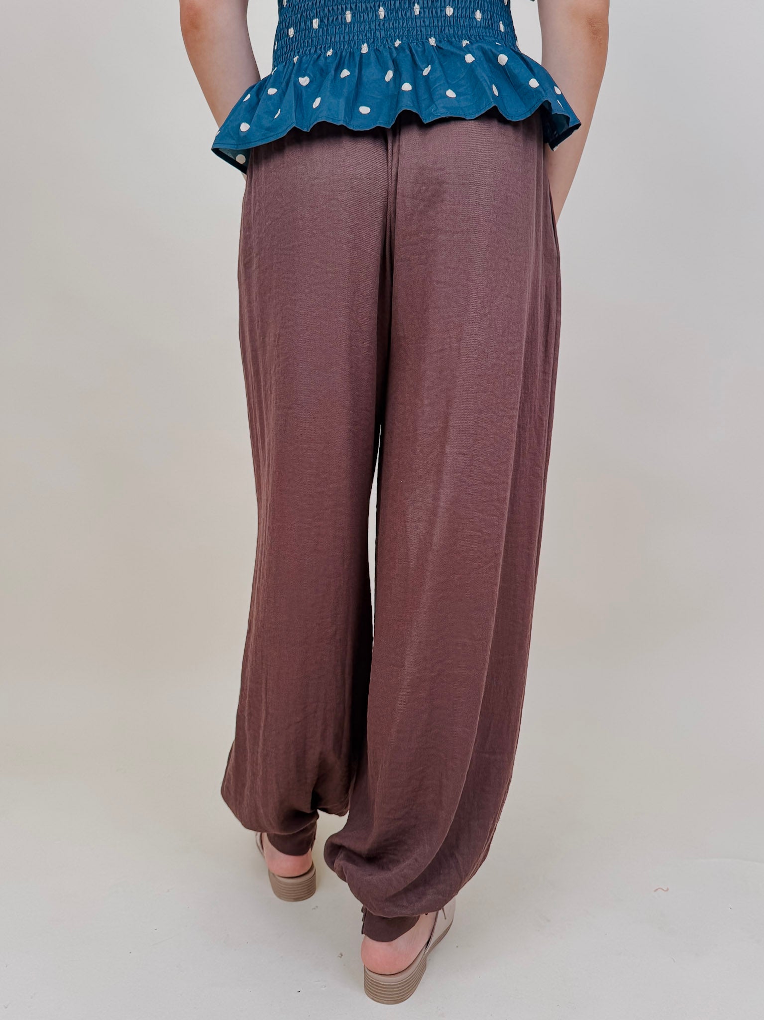 Penny For Your Thoughts Pant in cocoa brown twill with pleated front and smocked ankle cuff — Paper Doll