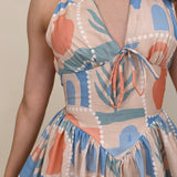 Off To Kokomo Maxi Dress in beige multi stamp print with halter neckline and open back bow — Paper Doll
